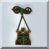 J098. Brass look scroll pin with drop purse pendant. - $14 